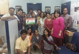 The HelpAge Kolkata team proudly holds up the Bharat Nirman Institutional Award honoring HelpAge India's work